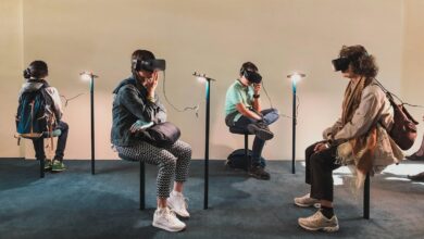 four person playing virtual reality goggles