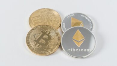 four round silver-colored and gold-colored Bitcoins