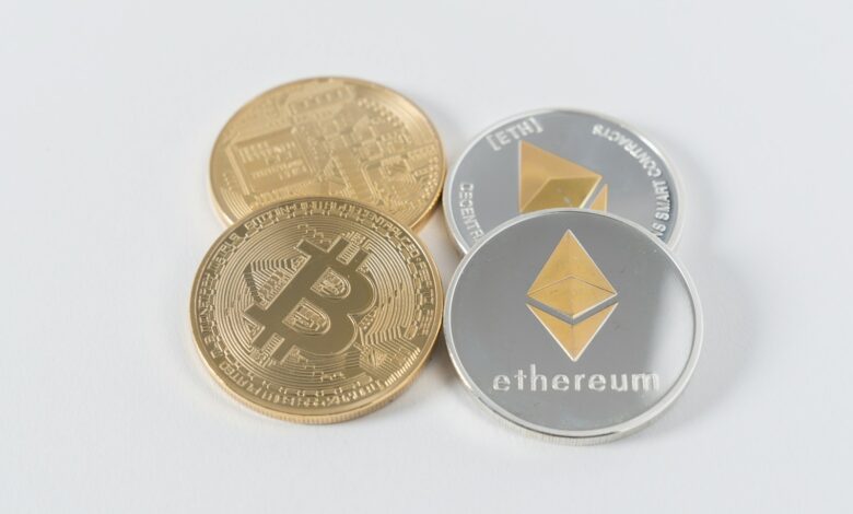 four round silver-colored and gold-colored Bitcoins