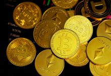 a pile of gold bitcoins sitting on top of each other