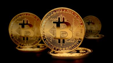 a group of gold bitcoins sitting on top of each other