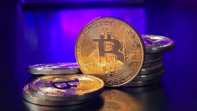 a pile of bitcoins sitting on top of a table