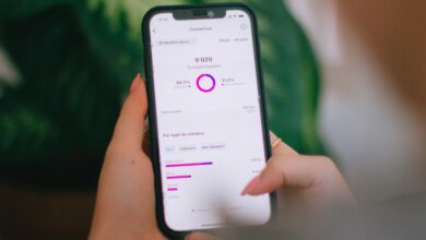 A person holding a cell phone in their hand