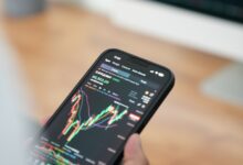 a person holding a cell phone in their hand